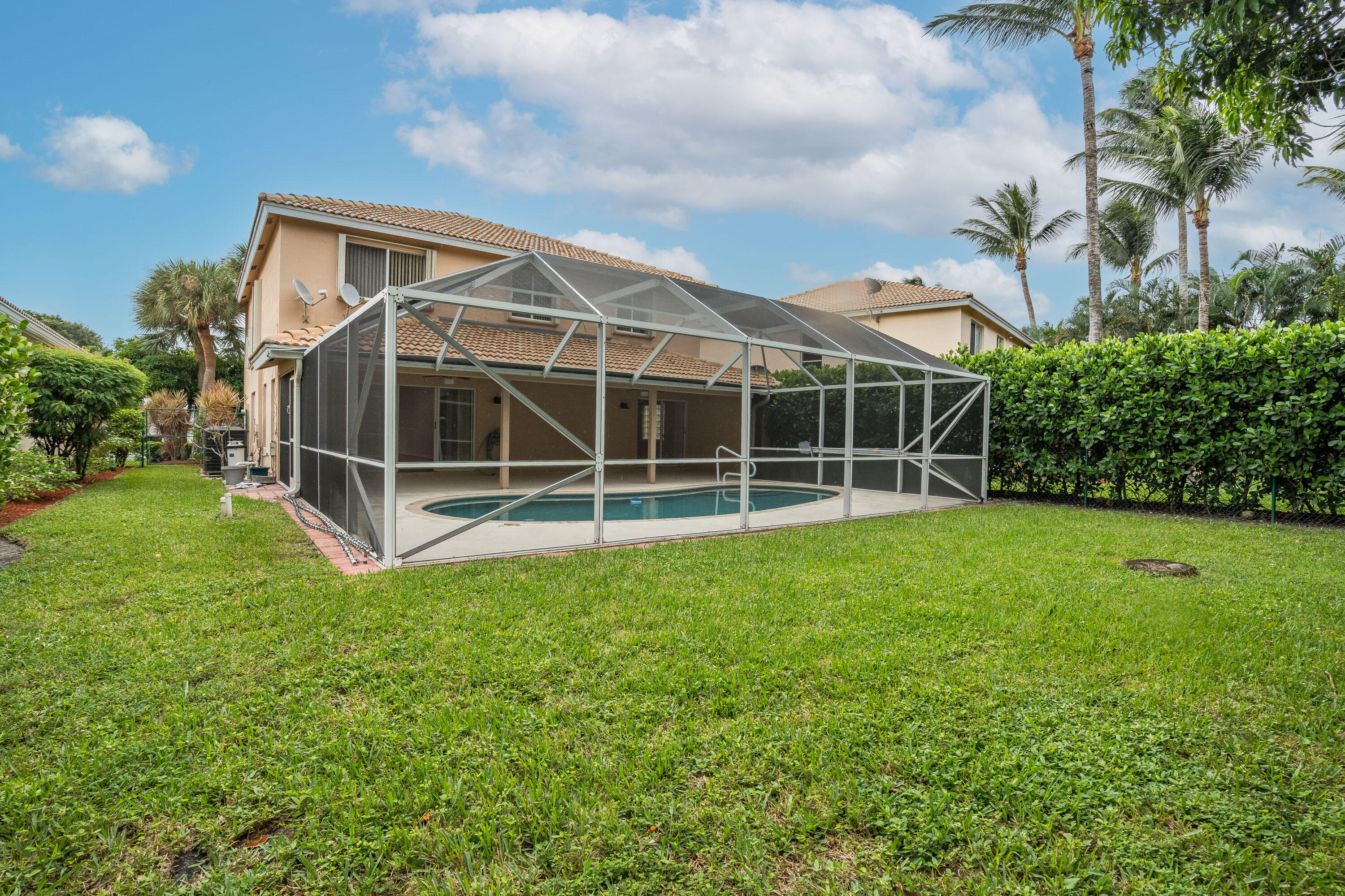1104 Rialto Drive Boynton Beach, FL 33436 - Photo 34 of 50 a view of a backyard with plants and large trees