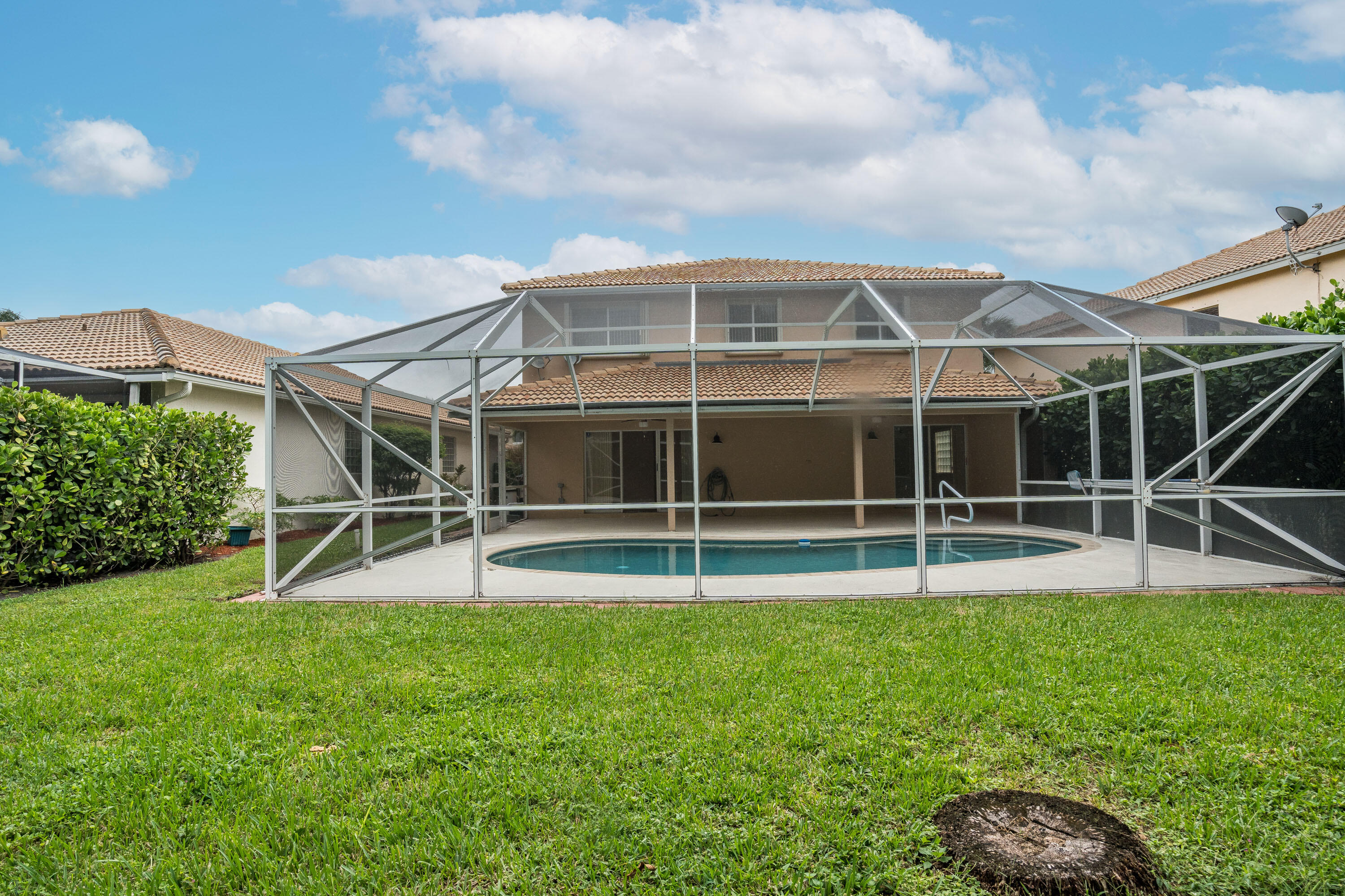 1104 Rialto Drive Boynton Beach, FL 33436 - Photo 35 of 50 a view of a house with a big yard and large trees