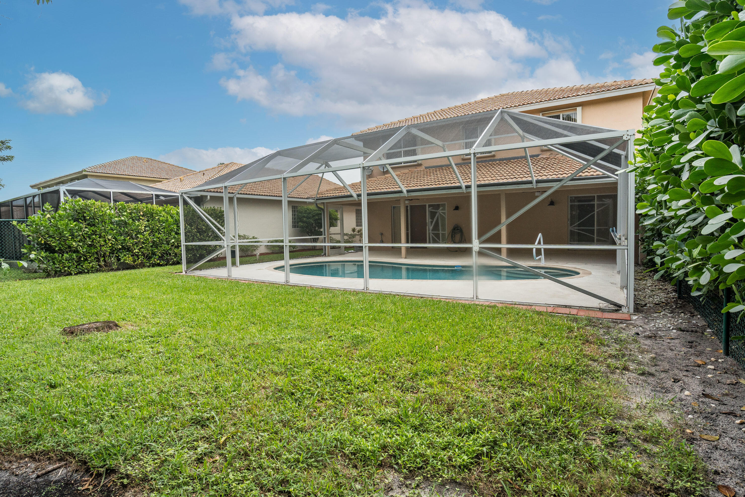 1104 Rialto Drive Boynton Beach, FL 33436 - Photo 36 of 50 a view of house with backyard and a garden