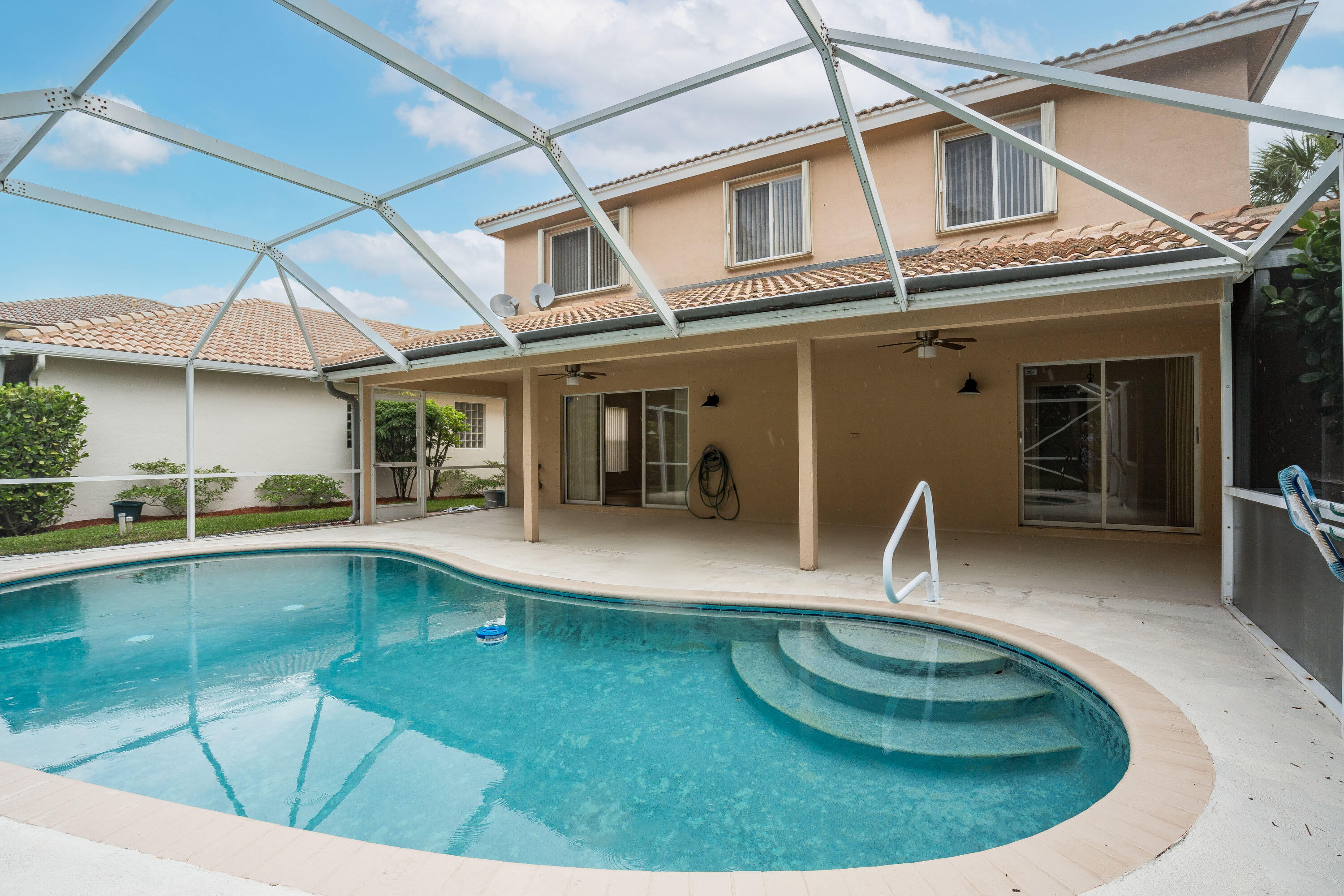 1104 Rialto Drive Boynton Beach, FL 33436 - Photo 38 of 50 a view of a swimming pool with a patio