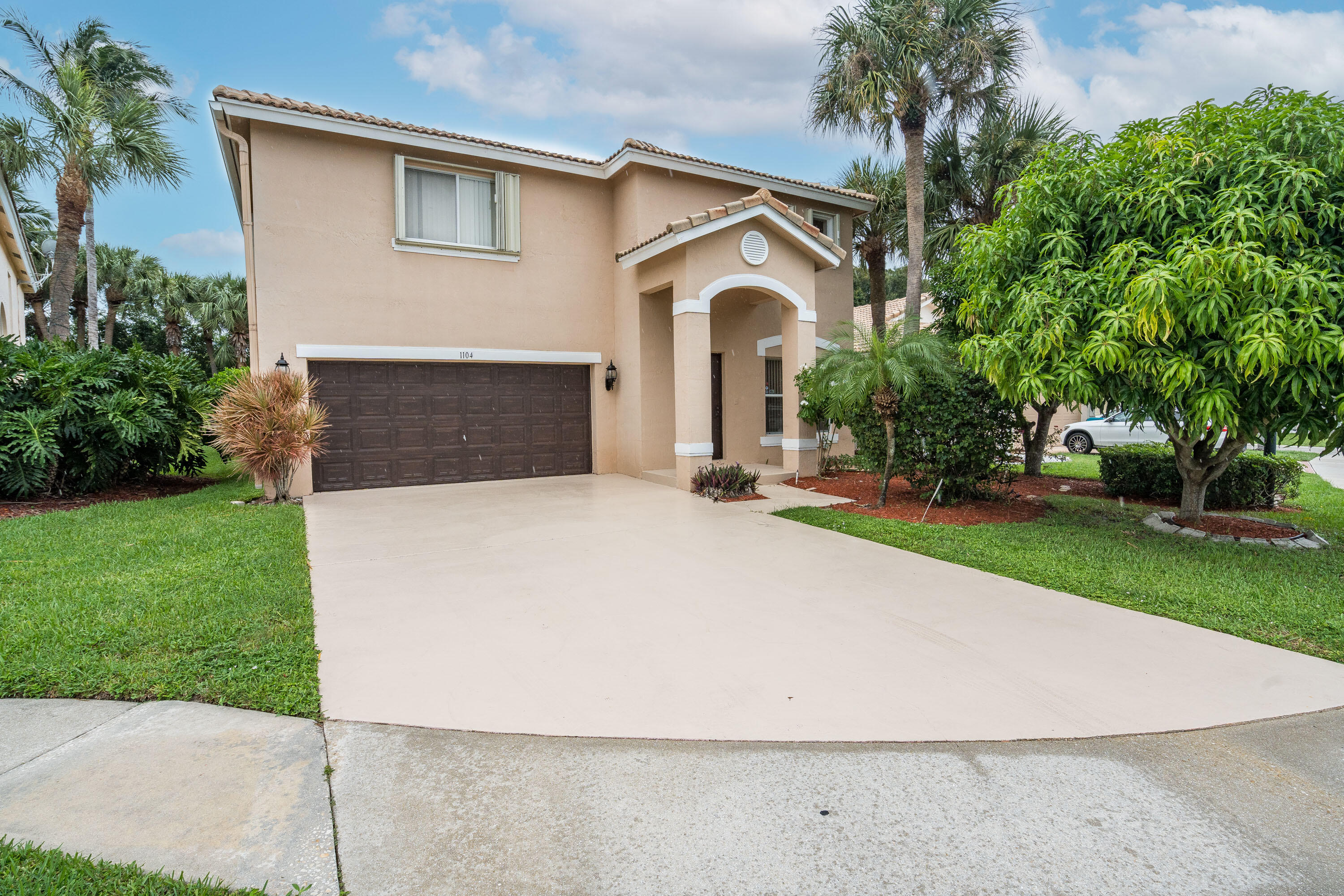 1104 Rialto Drive Boynton Beach, FL 33436 - Photo 39 of 50 a front view of a house with a yard