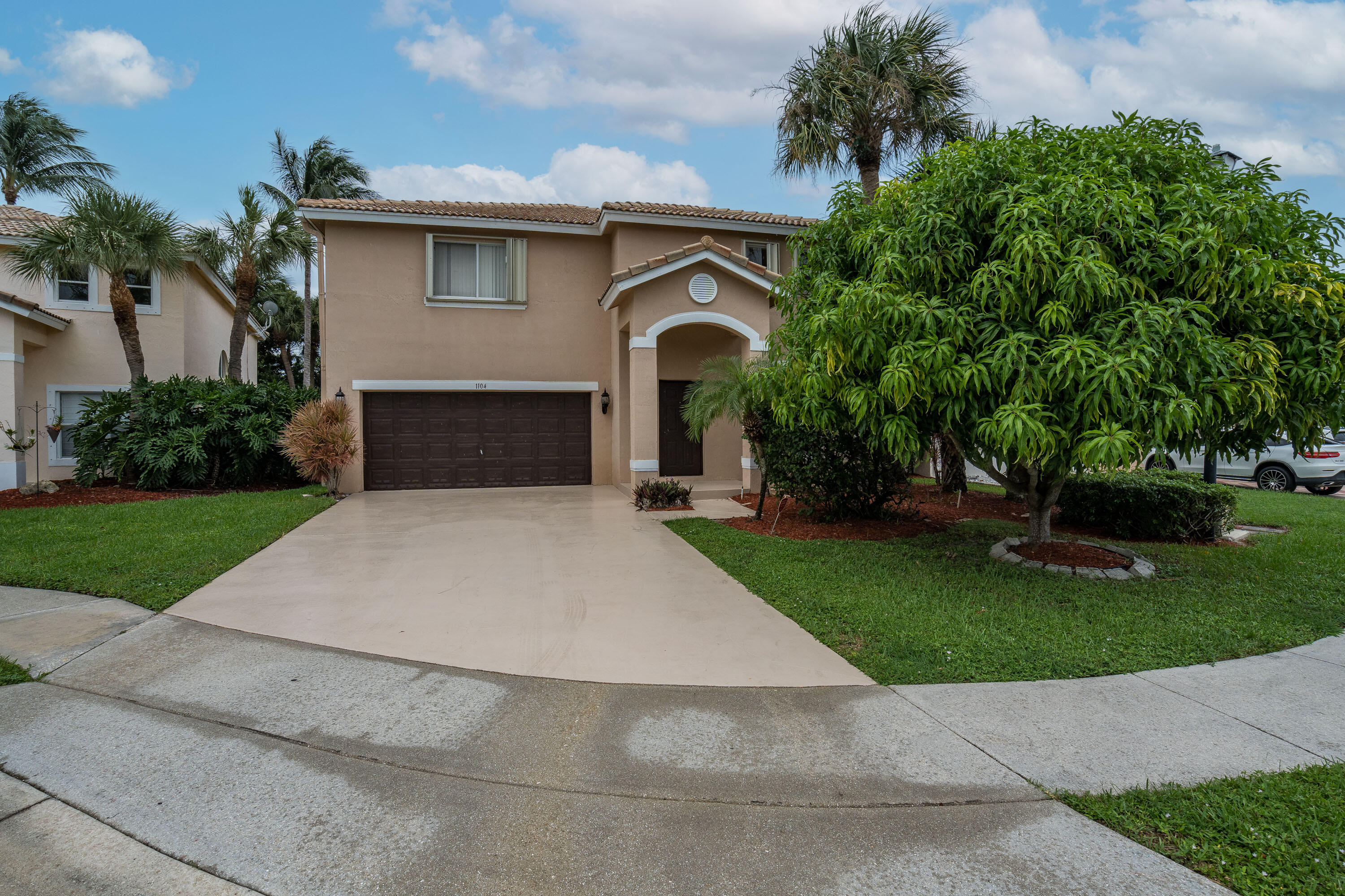 1104 Rialto Drive Boynton Beach, FL 33436 - Photo 43 of 50 a front view of a house with garden