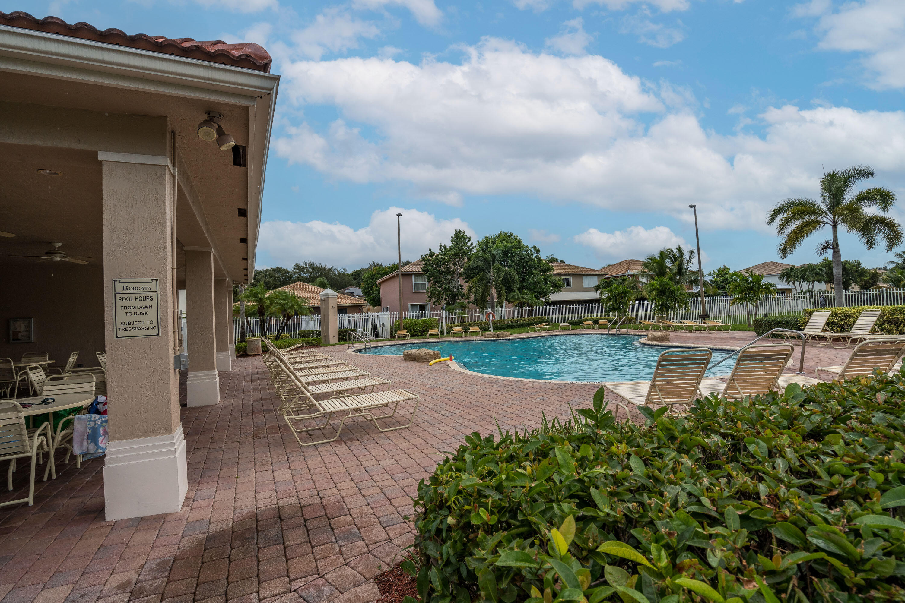 1104 Rialto Drive Boynton Beach, FL 33436 - Photo 45 of 50 a swimming pool with outdoor seating and yard