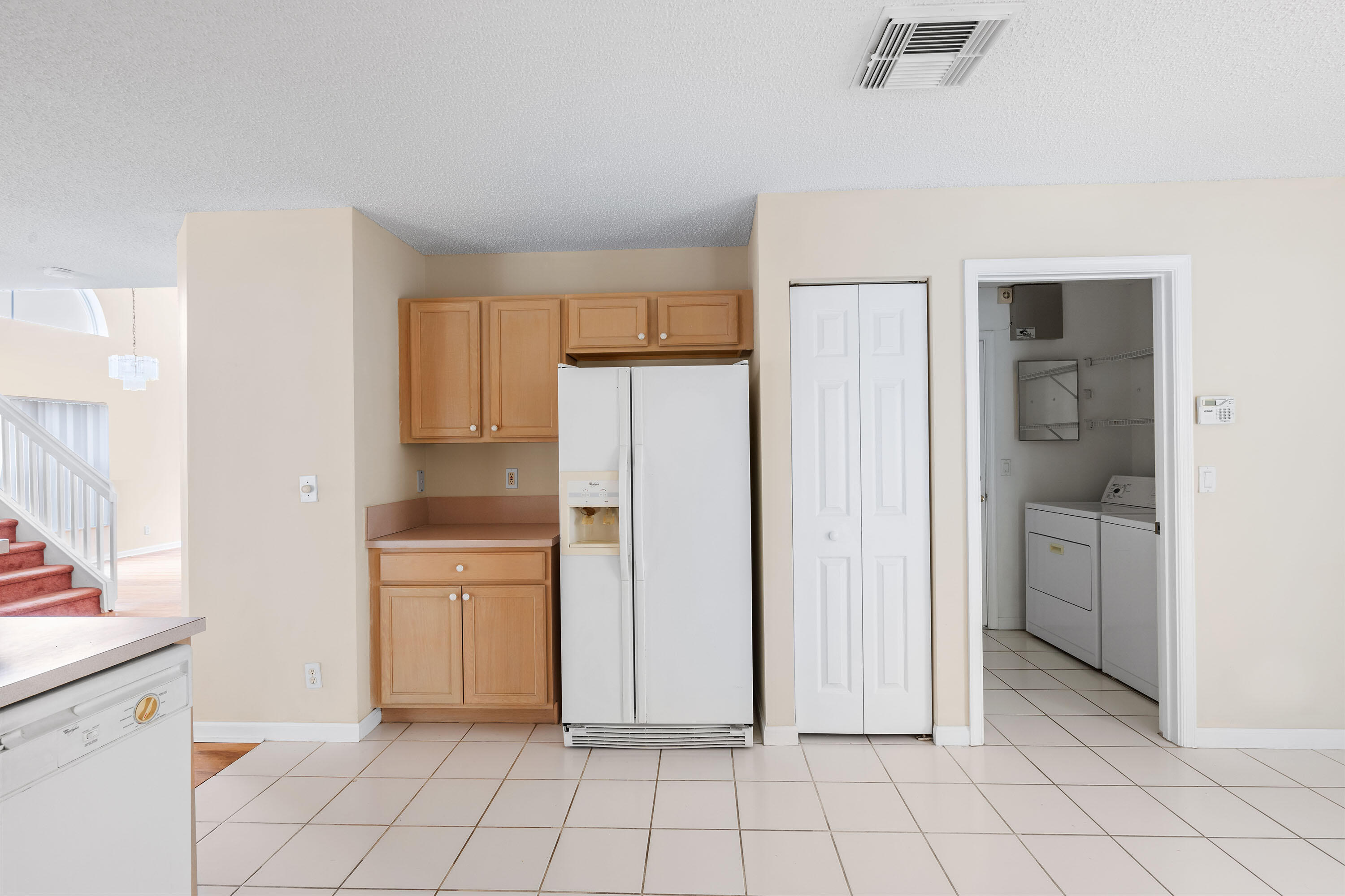 1104 Rialto Drive Boynton Beach, FL 33436 - Photo 9 of 50 a view of a kitchen with white cabinets and entryway