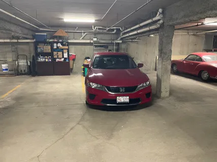 a view of a small room with wooden walls