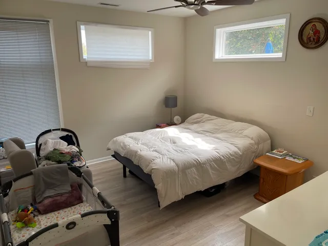 a bedroom with a bed and cabinets