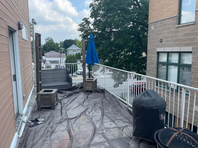 a view of balcony with furniture