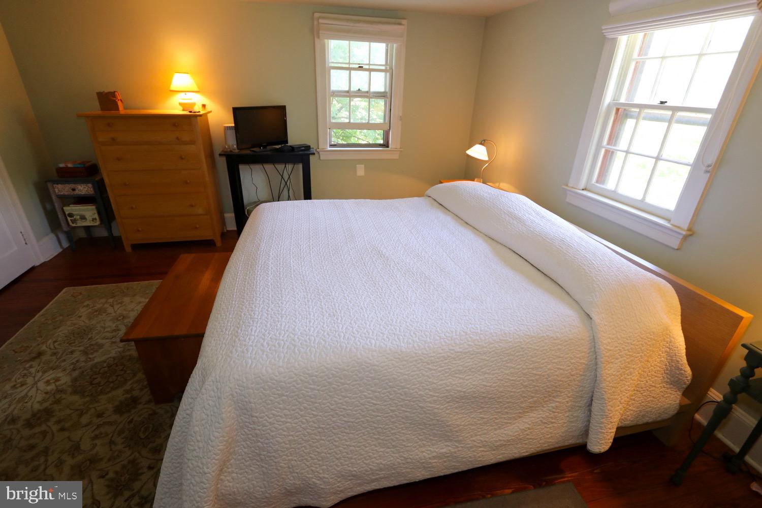 2701 Alden Road Bryn Athyn, PA 19006 - Photo 68 of 105 a bed sitting in a bedroom next to a window
