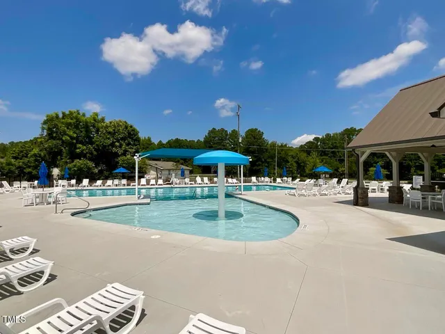 a view of a swimming pool with a patio