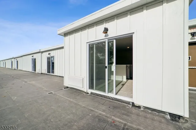 a view of a white house with front door