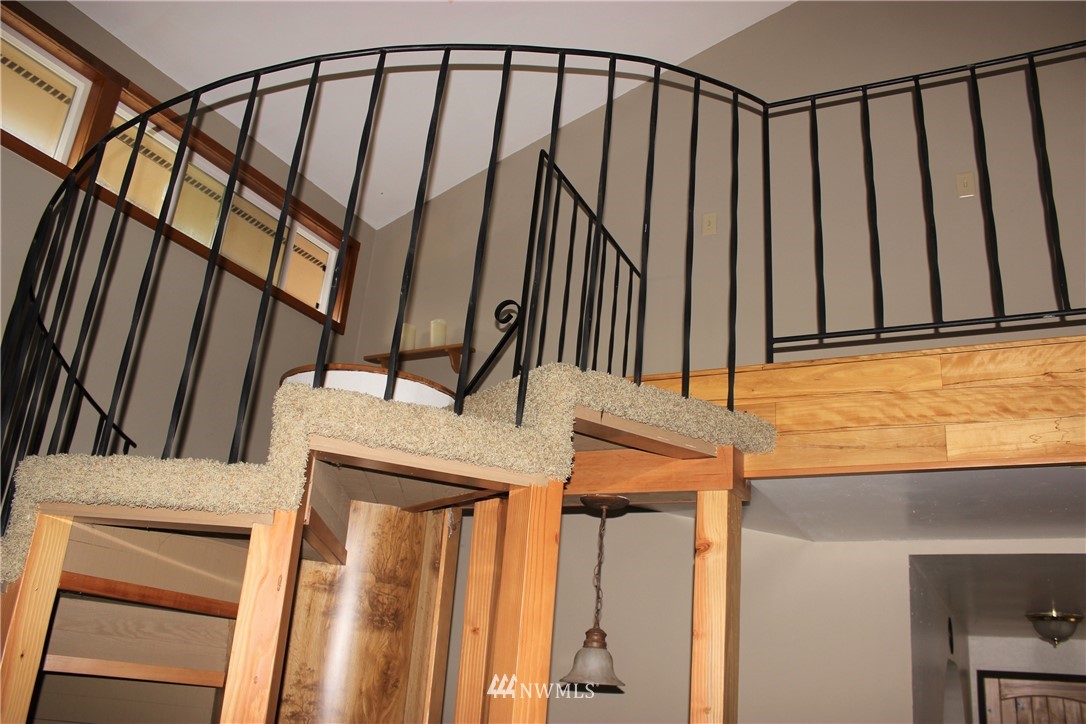 9344 Lundeen Road Southwest Rochester, WA 98579 - Photo 13 of 40 a view of staircase with railing and a window