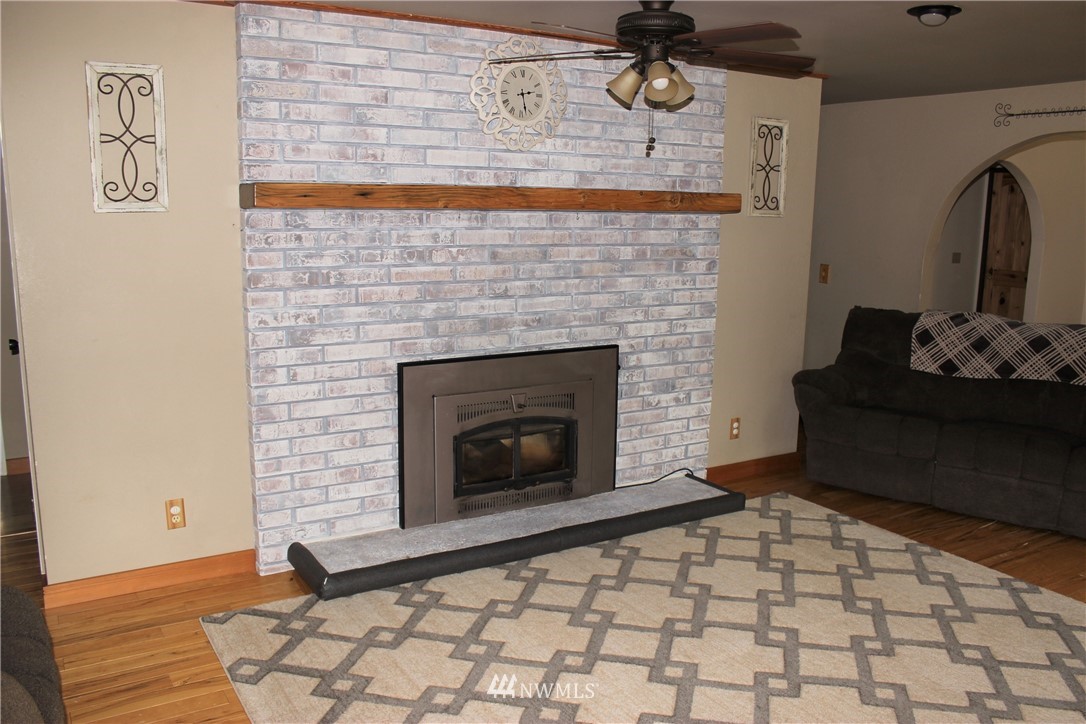 9344 Lundeen Road Southwest Rochester, WA 98579 - Photo 16 of 40 a living room with a fireplace
