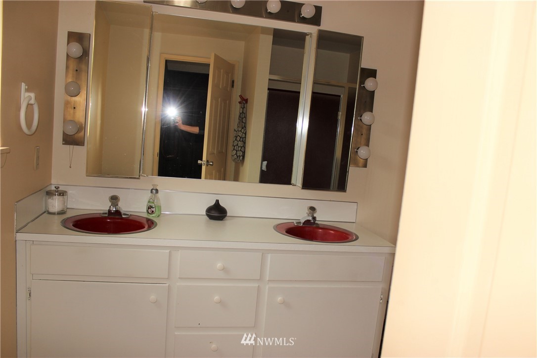 9344 Lundeen Road Southwest Rochester, WA 98579 - Photo 22 of 40 a bathroom with a sink and a mirror