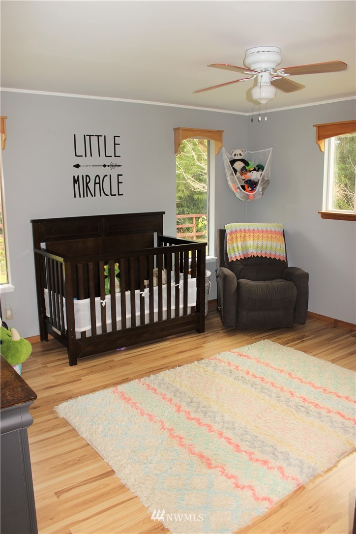 9344 Lundeen Road Southwest Rochester, WA 98579 - Photo 23 of 40 a view of a bedroom with furniture and window