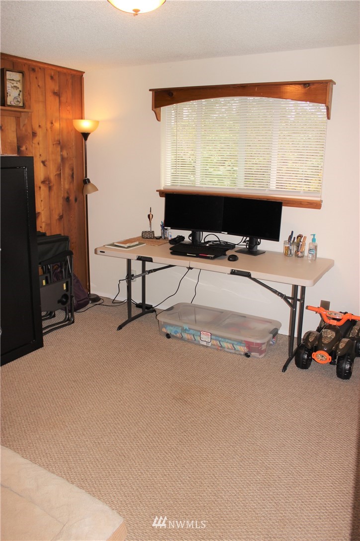 9344 Lundeen Road Southwest Rochester, WA 98579 - Photo 24 of 40 a room with a flat screen tv and a view of living room