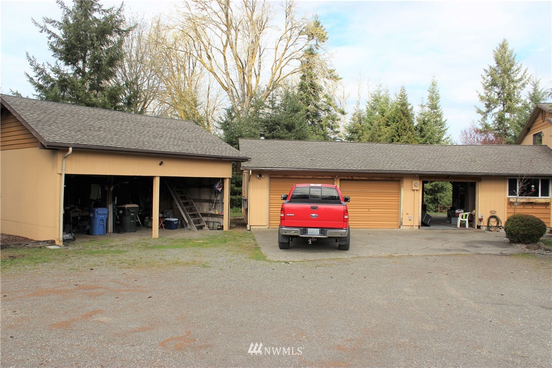 9344 Lundeen Road Southwest Rochester, WA 98579 - Photo 35 of 40 a view of a car in front of garage