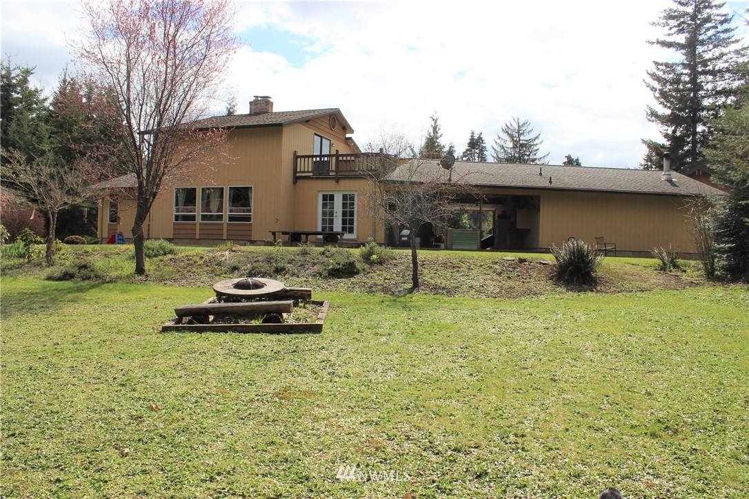 9344 Lundeen Road Southwest Rochester, WA 98579 - Photo 36 of 40 a view of a house with backyard