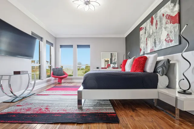 a bedroom with a bed and window