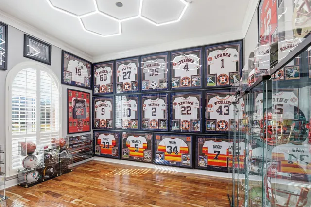 a living room with furniture and a dining table