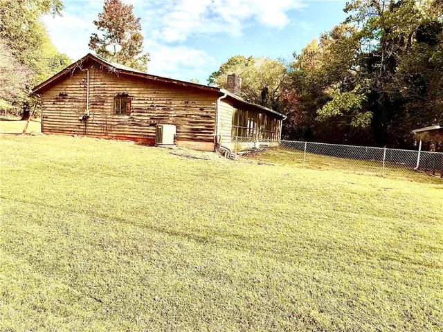 a view of yard with swimming pool