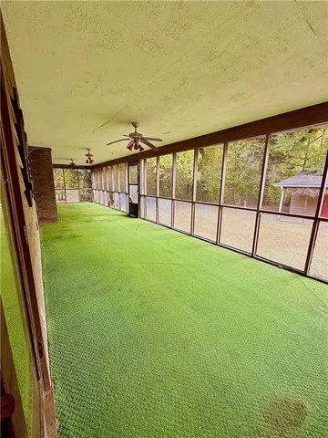 a view of pool with trees in the background