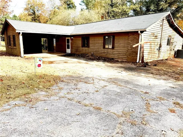 a house with trees in the background