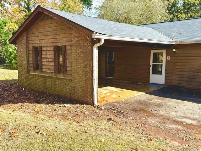 a view of an empty room with windows