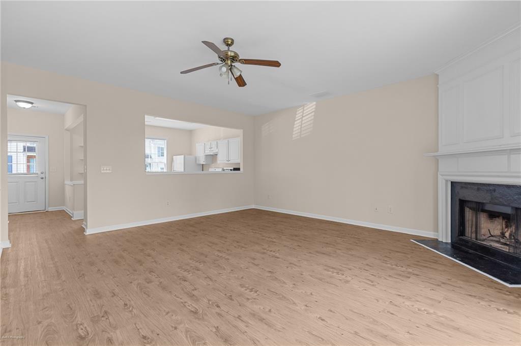 1010 Bendleton Trace Alpharetta, GA 30004 - Photo 11 of 25 an empty room with windows and fireplace