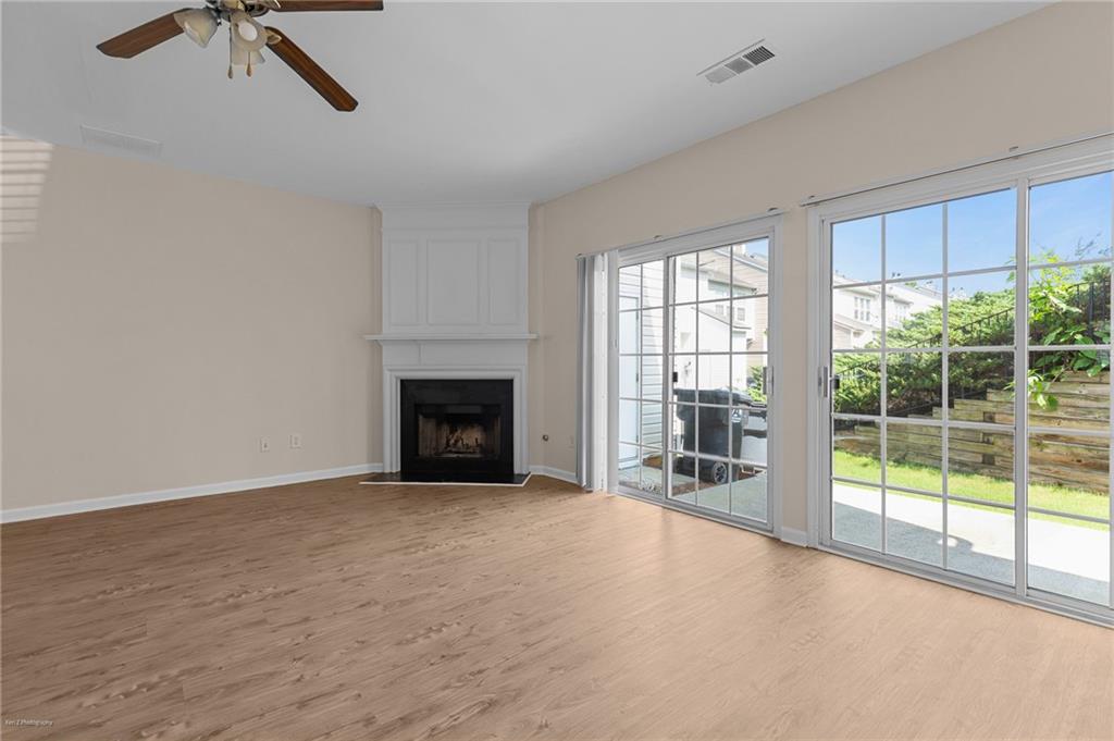 1010 Bendleton Trace Alpharetta, GA 30004 - Photo 12 of 25 a view of an empty room with a fireplace and a window