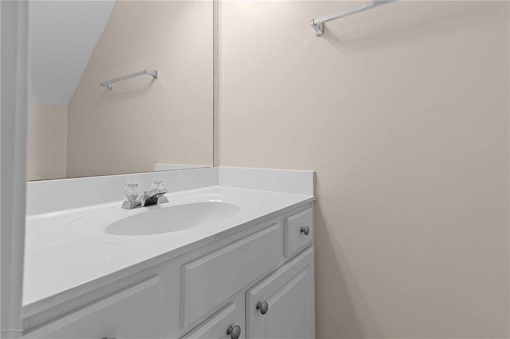 1010 Bendleton Trace Alpharetta, GA 30004 - Photo 13 of 25 a bathroom with a sink and a mirror