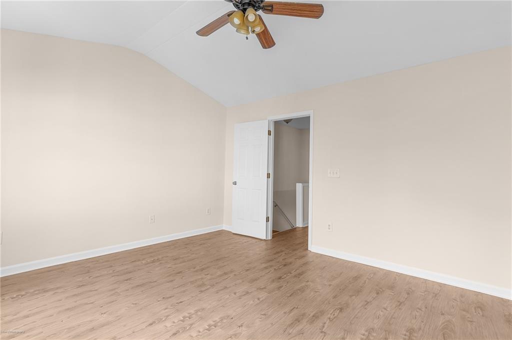 1010 Bendleton Trace Alpharetta, GA 30004 - Photo 15 of 25 a view of a room with wooden floor and white walls