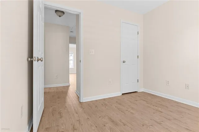 an empty room with wooden floor