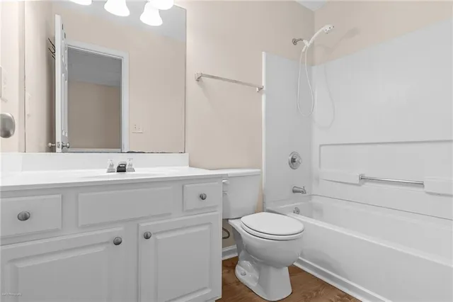 a bathroom with a sink a toilet and a bathtub