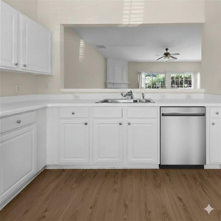 1010 Bendleton Trace Alpharetta, GA 30004 - Photo 6 of 25 a kitchen with granite countertop white cabinets and white appliances
