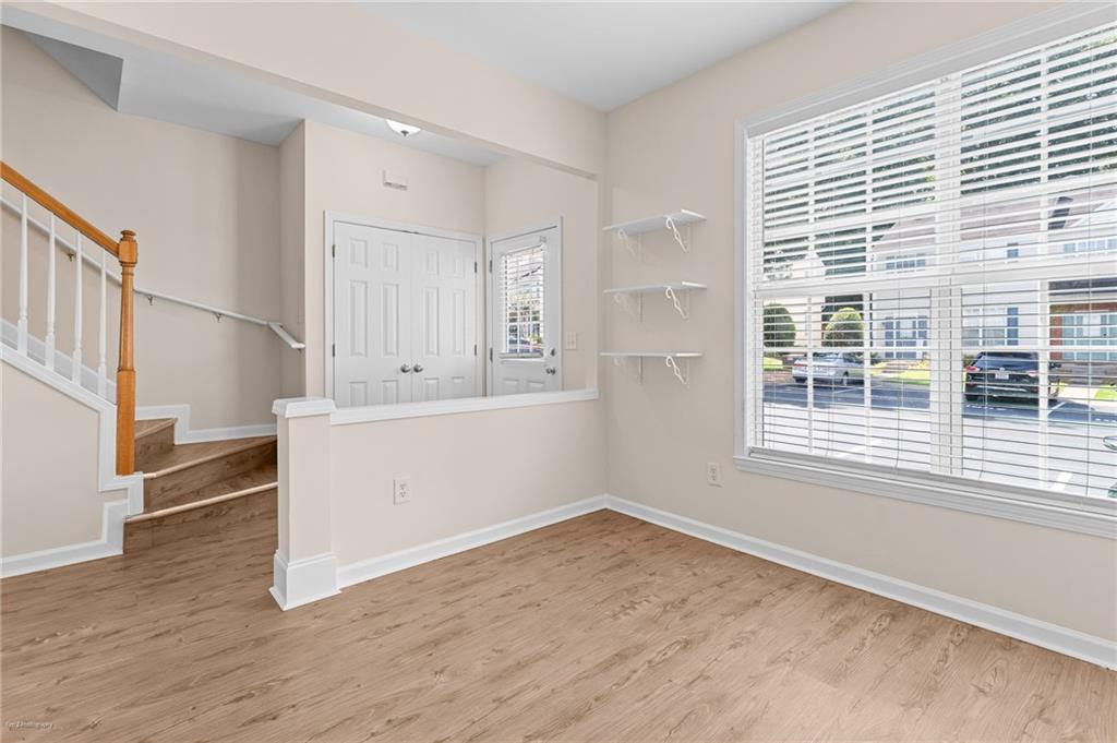 1010 Bendleton Trace Alpharetta, GA 30004 - Photo 7 of 25 a view of empty room with wooden floor and fan