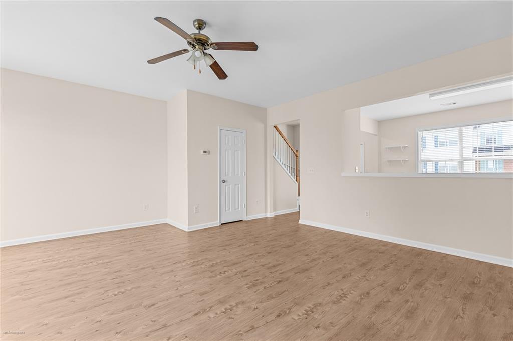 1010 Bendleton Trace Alpharetta, GA 30004 - Photo 9 of 25 wooden floor in an empty room with a window