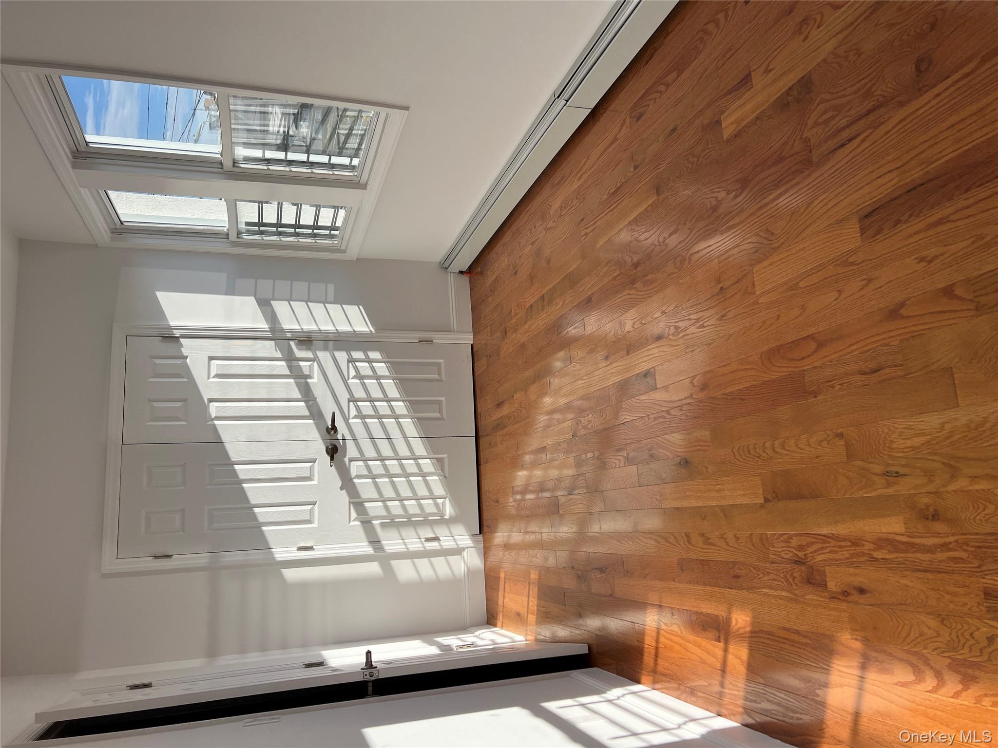 216-25 136th Road, Unit 1 2 AND 3 Queens, NY 11413 - Photo 12 of 43 a view of an empty room with windows