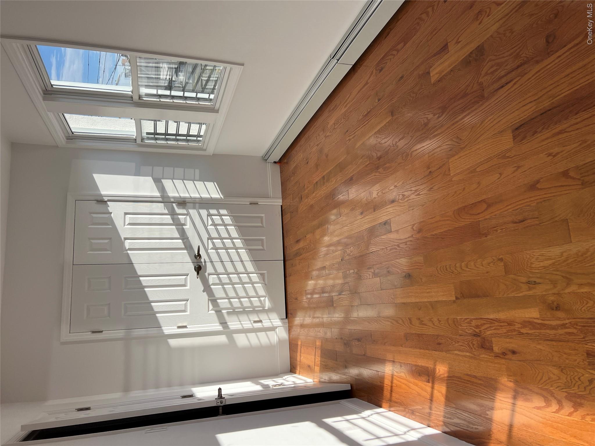 216-25 136th Road, Unit 1 2 AND 3 Queens, NY 11413 - Photo 12 of 43 a view of an empty room with windows