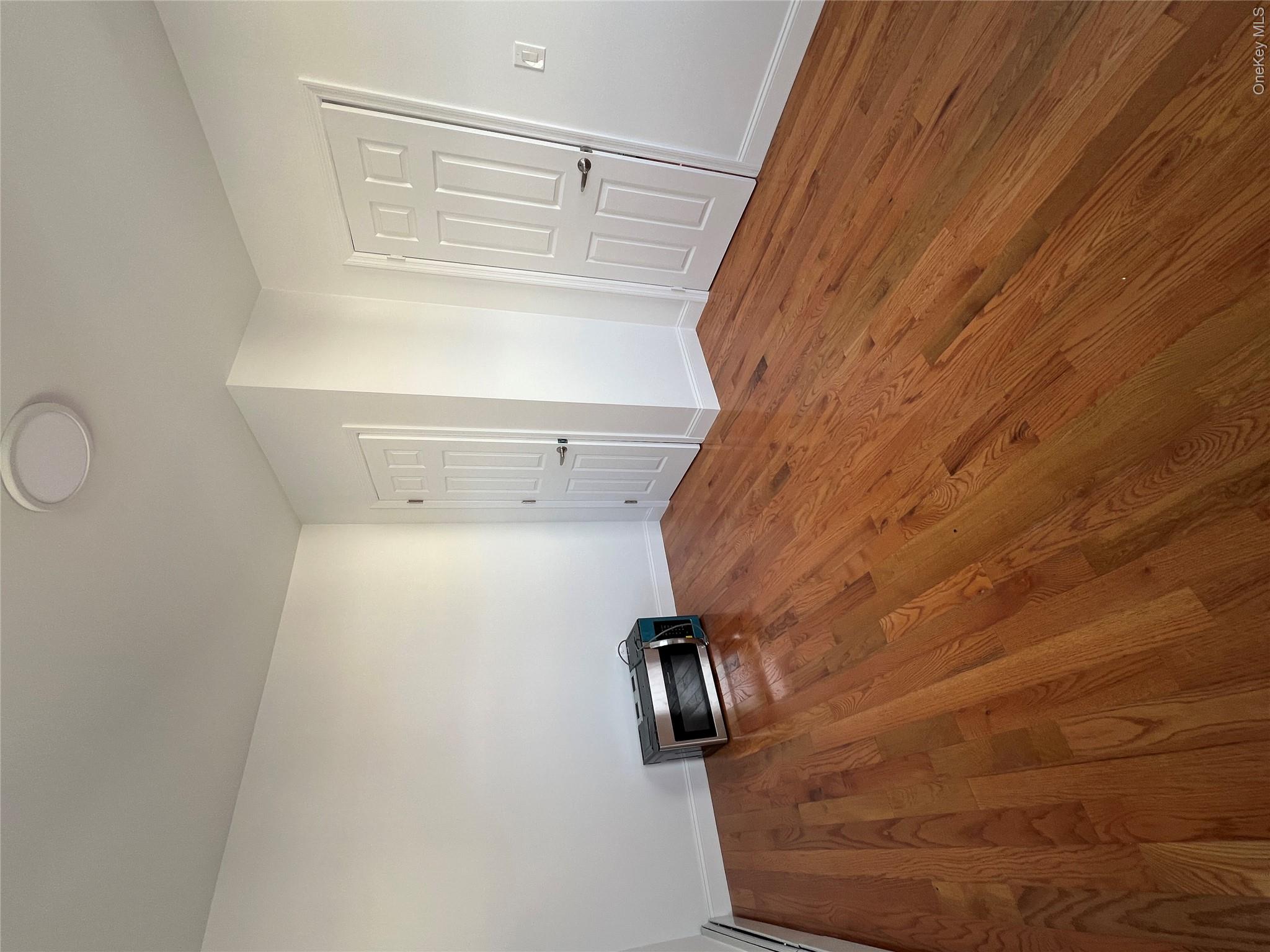 216-25 136th Road, Unit 1 2 AND 3 Queens, NY 11413 - Photo 17 of 43 a view of a livingroom with wooden floor