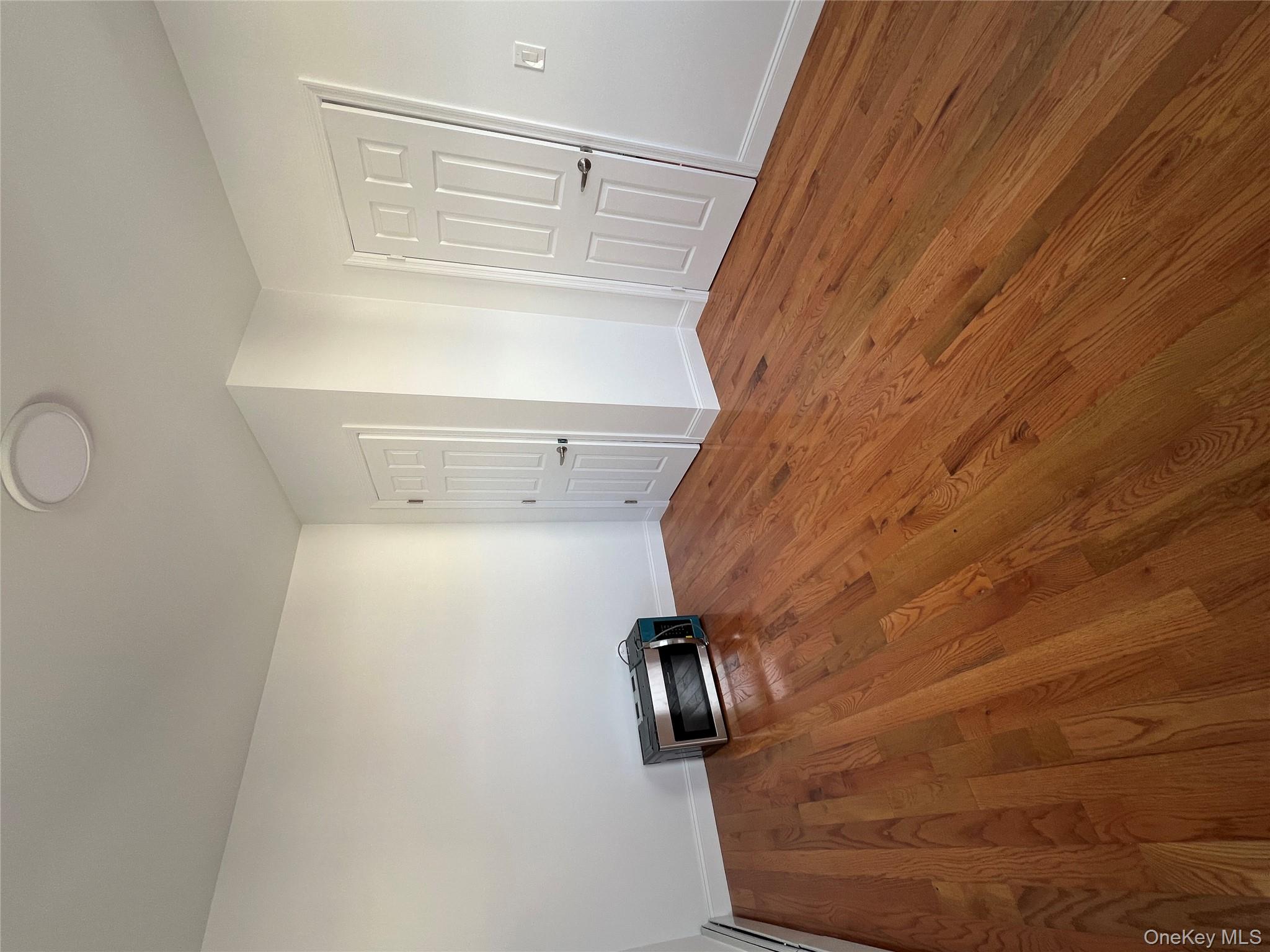 216-25 136th Road, Unit 1 2 AND 3 Queens, NY 11413 - Photo 17 of 43 a view of a livingroom with wooden floor
