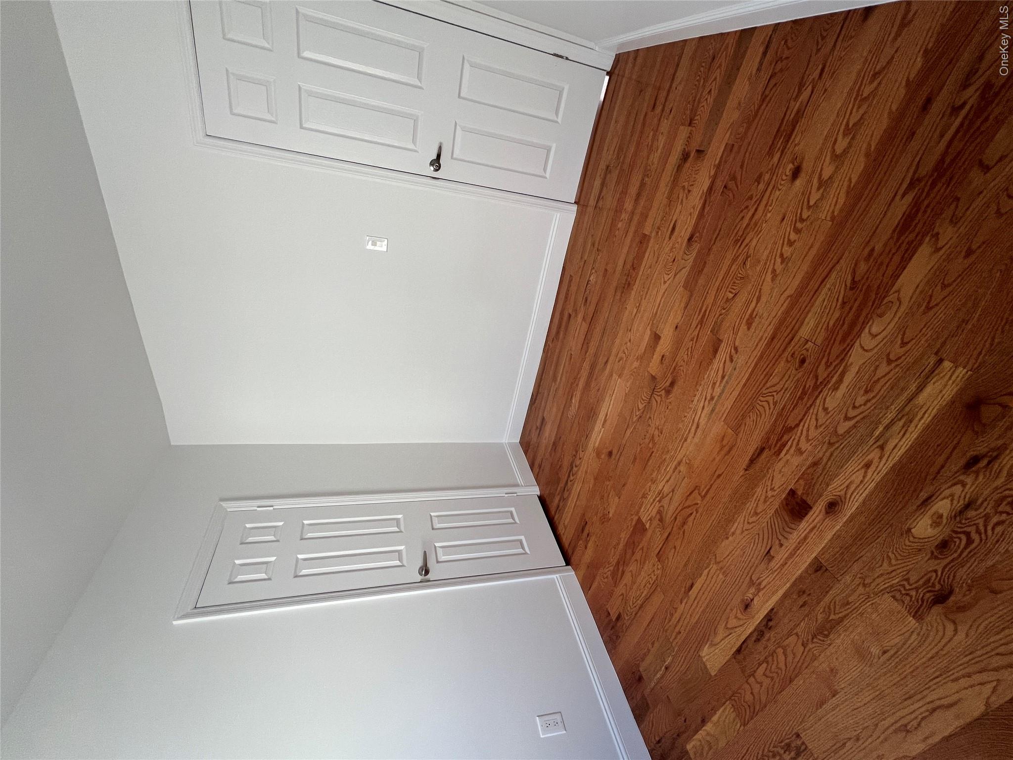 216-25 136th Road, Unit 1 2 AND 3 Queens, NY 11413 - Photo 19 of 43 a view of empty room with wooden floor and fan