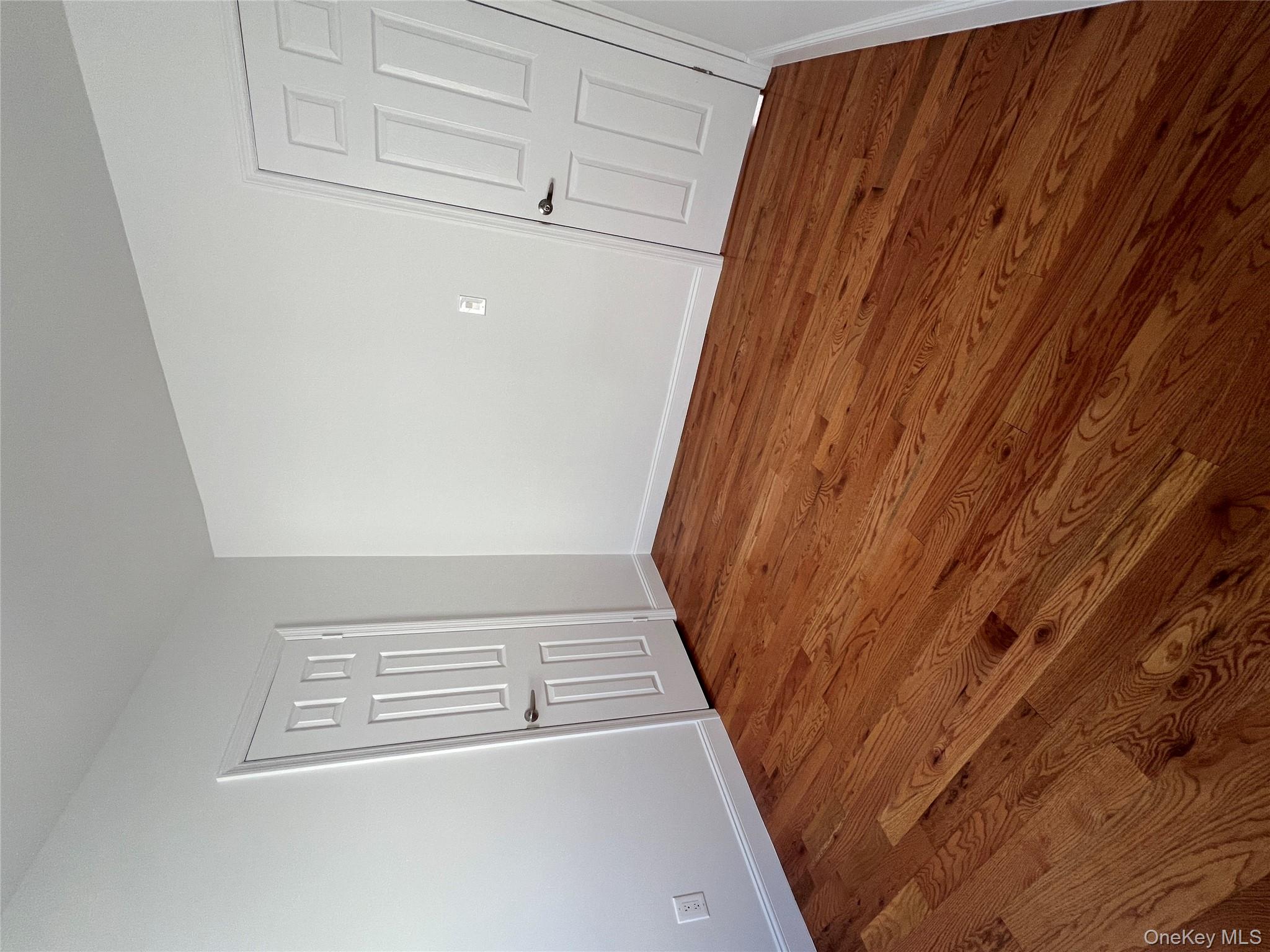 216-25 136th Road, Unit 1 2 AND 3 Queens, NY 11413 - Photo 19 of 43 a view of empty room with wooden floor and fan