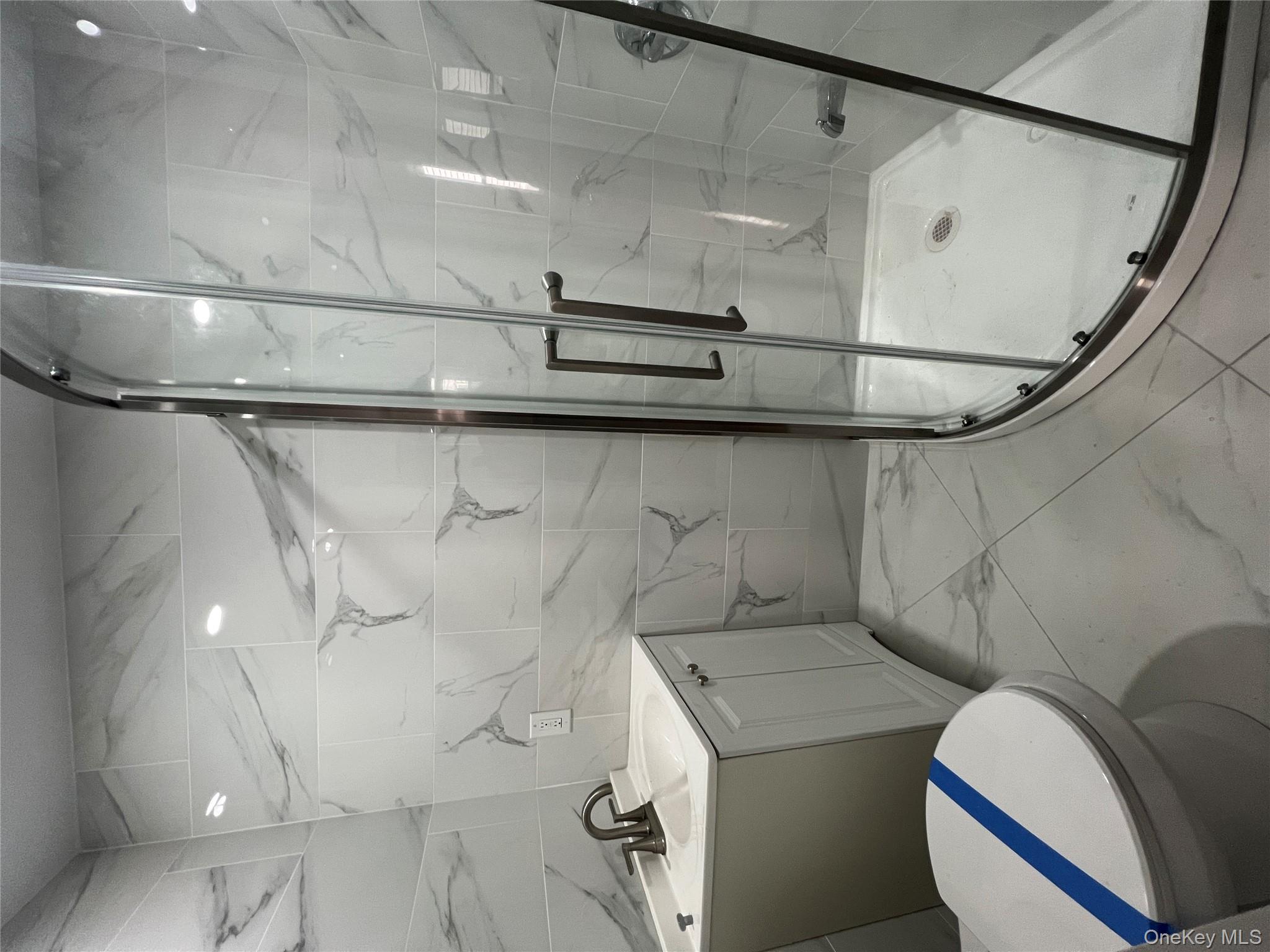 216-25 136th Road, Unit 1 2 AND 3 Queens, NY 11413 - Photo 20 of 43 a bathroom with a sink toilet and shower