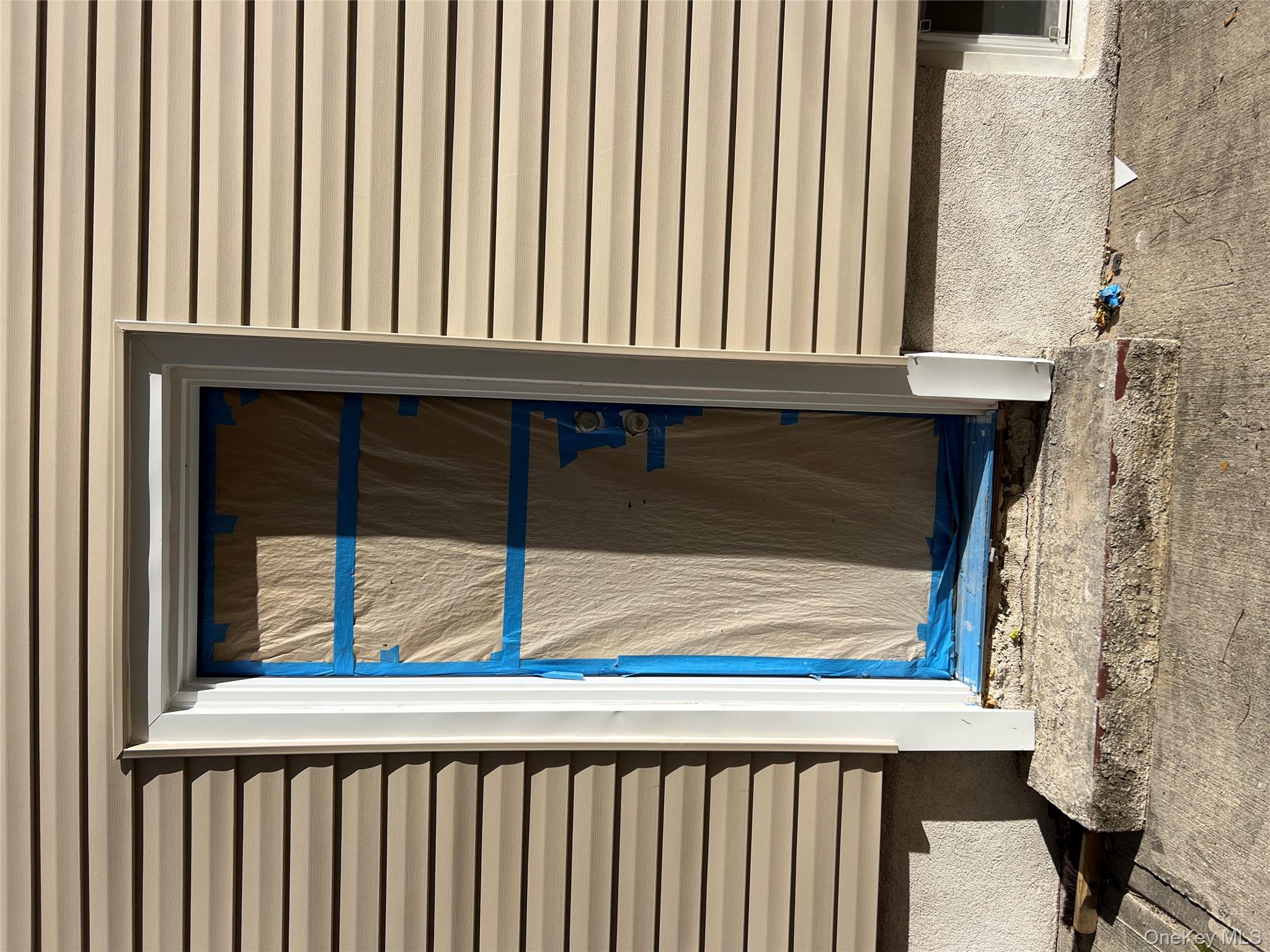 216-25 136th Road, Unit 1 2 AND 3 Queens, NY 11413 - Photo 33 of 43 a view of a door and a window