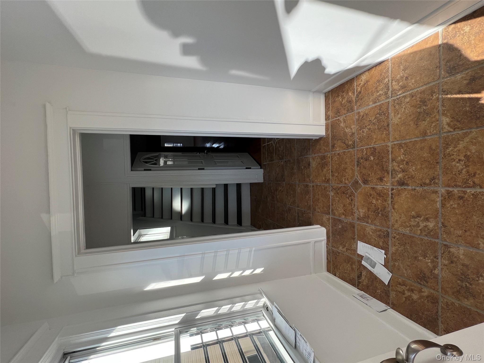 216-25 136th Road, Unit 1 2 AND 3 Queens, NY 11413 - Photo 35 of 43 a view of entryway with hallway and wooden floor