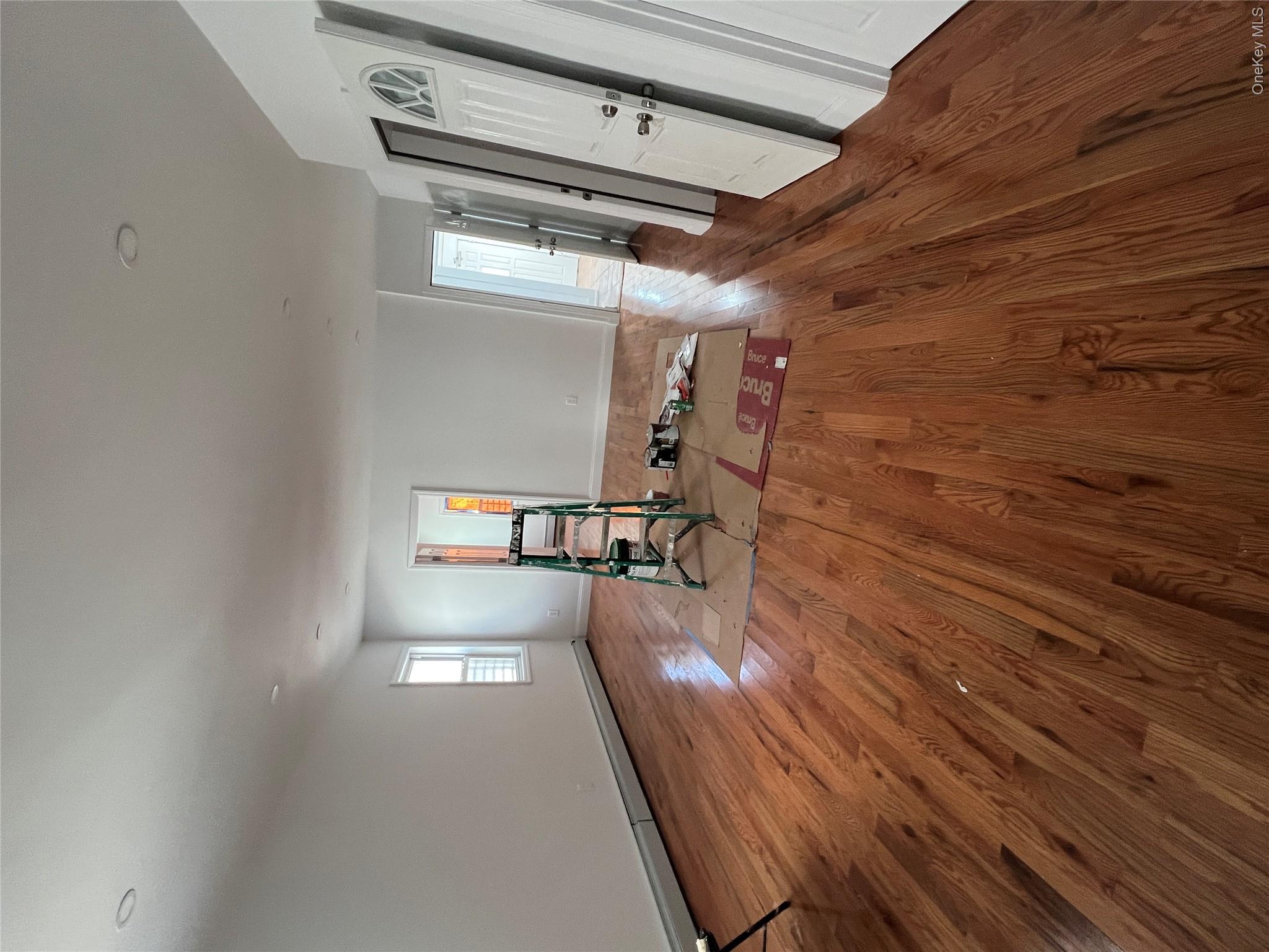 216-25 136th Road, Unit 1 2 AND 3 Queens, NY 11413 - Photo 5 of 43 a view of empty room with wooden floor