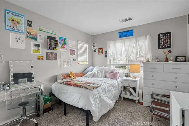 a view of a house with a yard and a patio