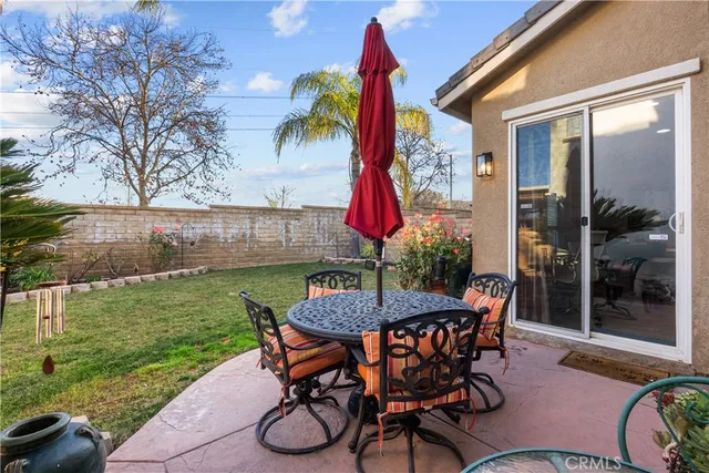 an aerial view of a balcony with chairs