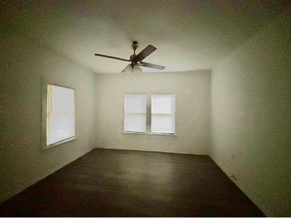 6124 Goforth Street Houston, TX 77021 - Photo 14 of 21 an empty room with a window and a ceiling fan
