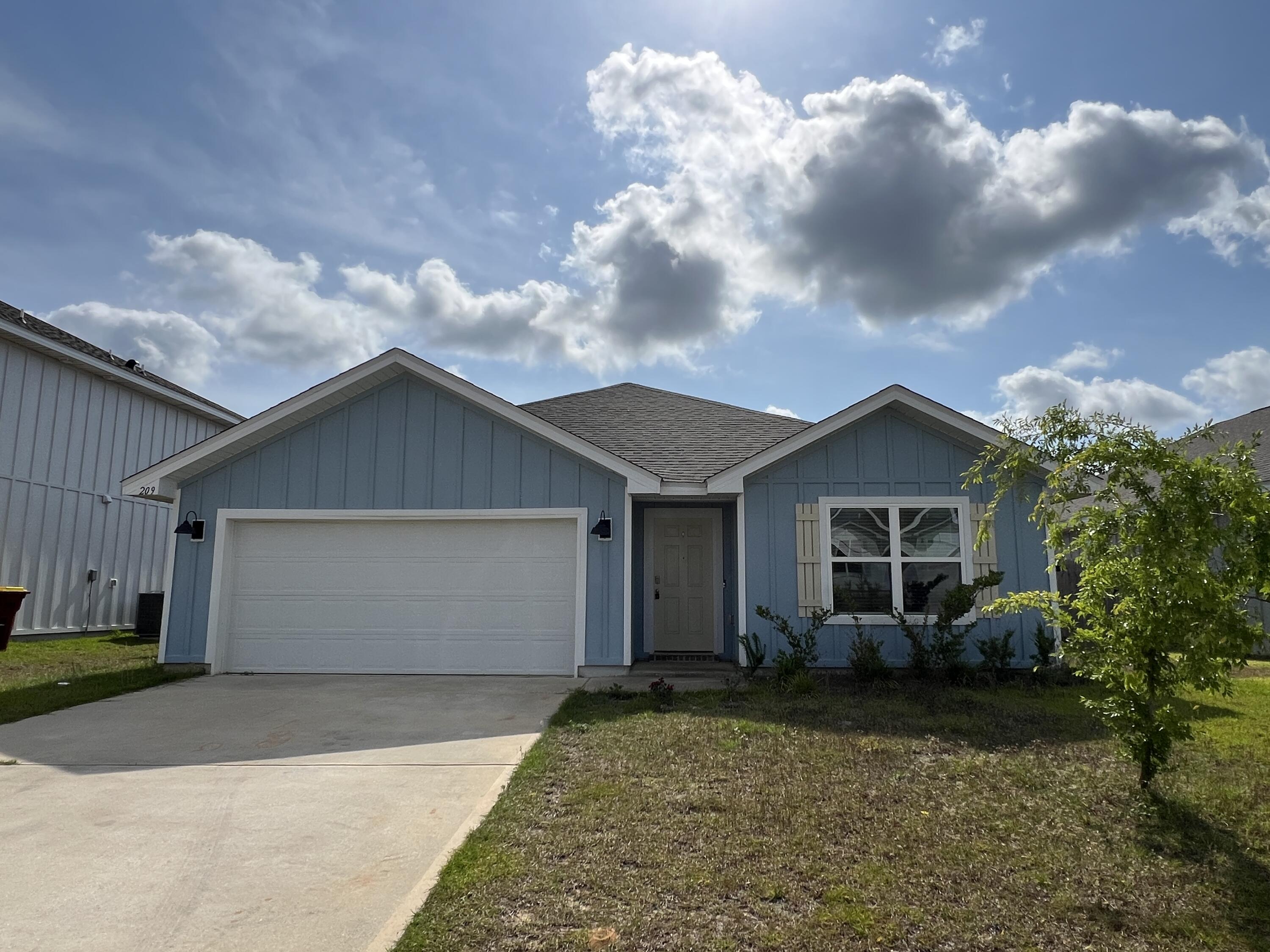 209 Laurel Hill Street Crestview, FL 32539 - Photo 1 of 24 a view of outdoor space yard and garage